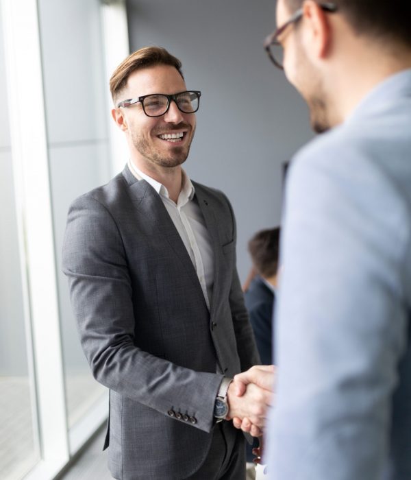 Business people shaking hands, finishing up meeting